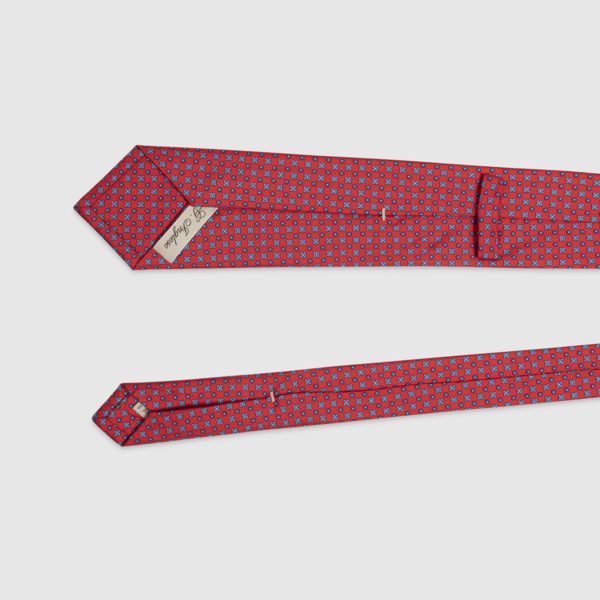 Red silk tie with blue micro pattern